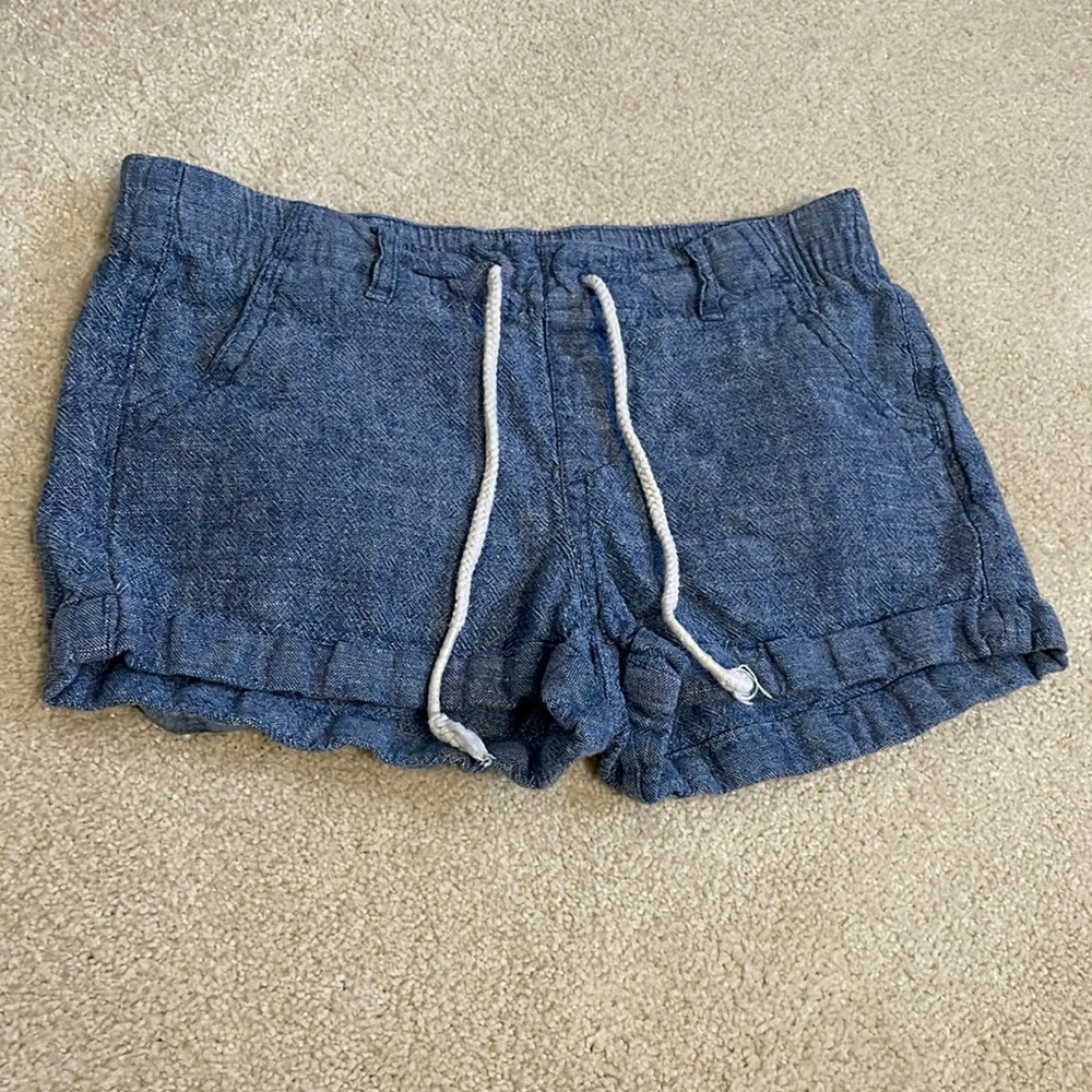 A pair of blue, jean looking Basic Edition shorts.